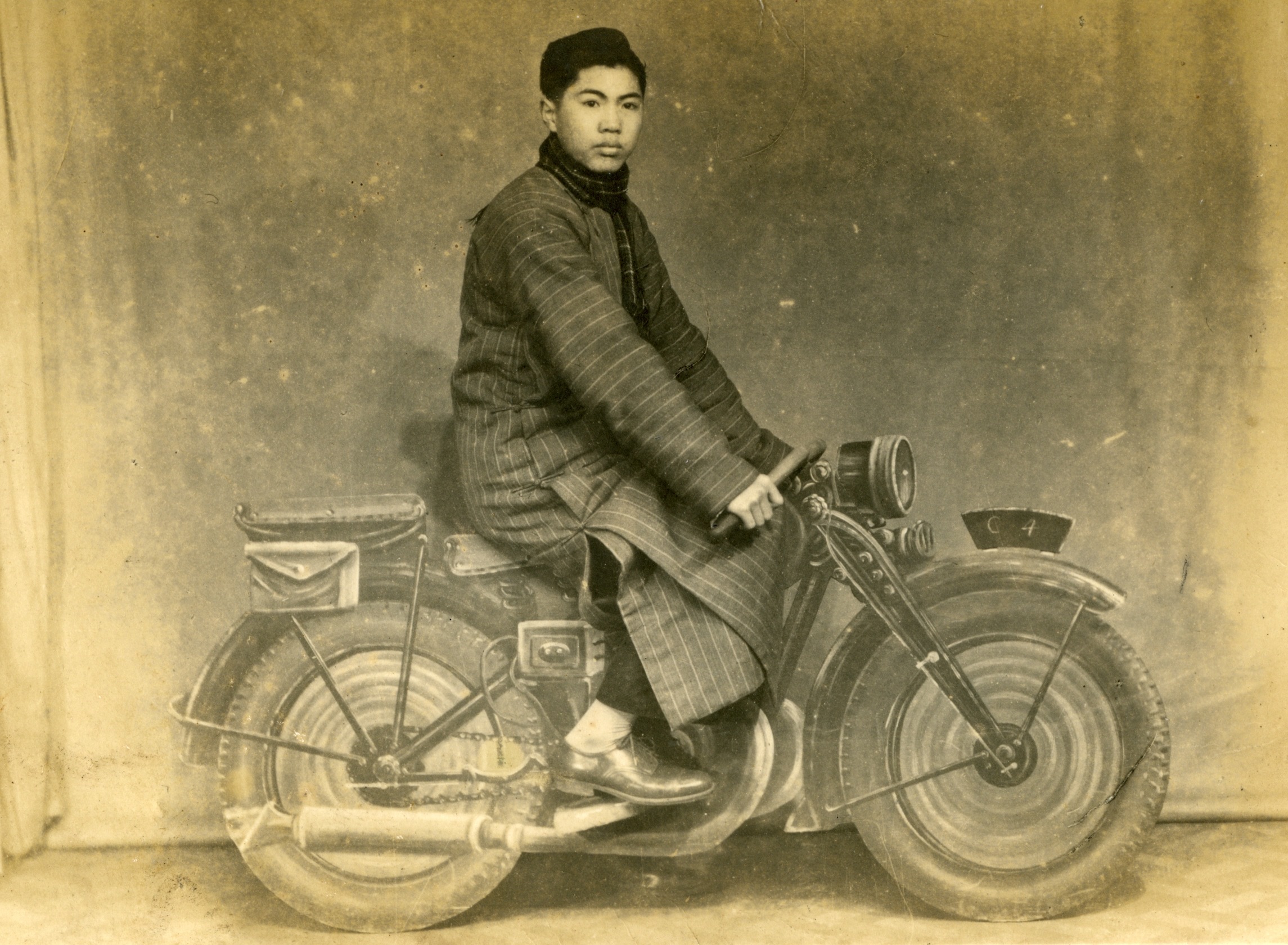 Boy on a 'motor-bike', early 1950s?