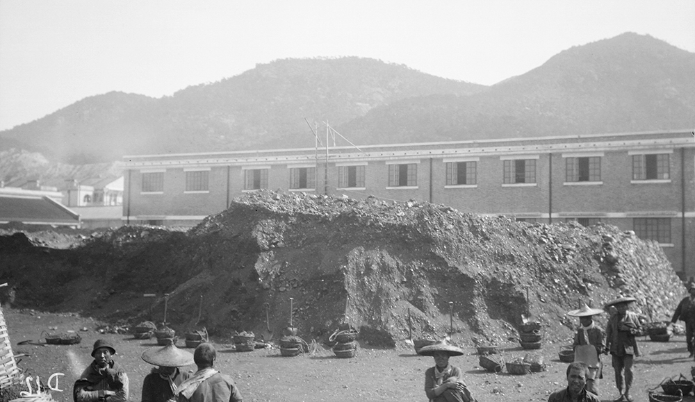 Coal heap, North Point Store, Hong Kong, 1919-1920.  Photograph by G. Warren Swire.  HPC ref: Sw04-015.  © 2007 John Swire & Sons Ltd.