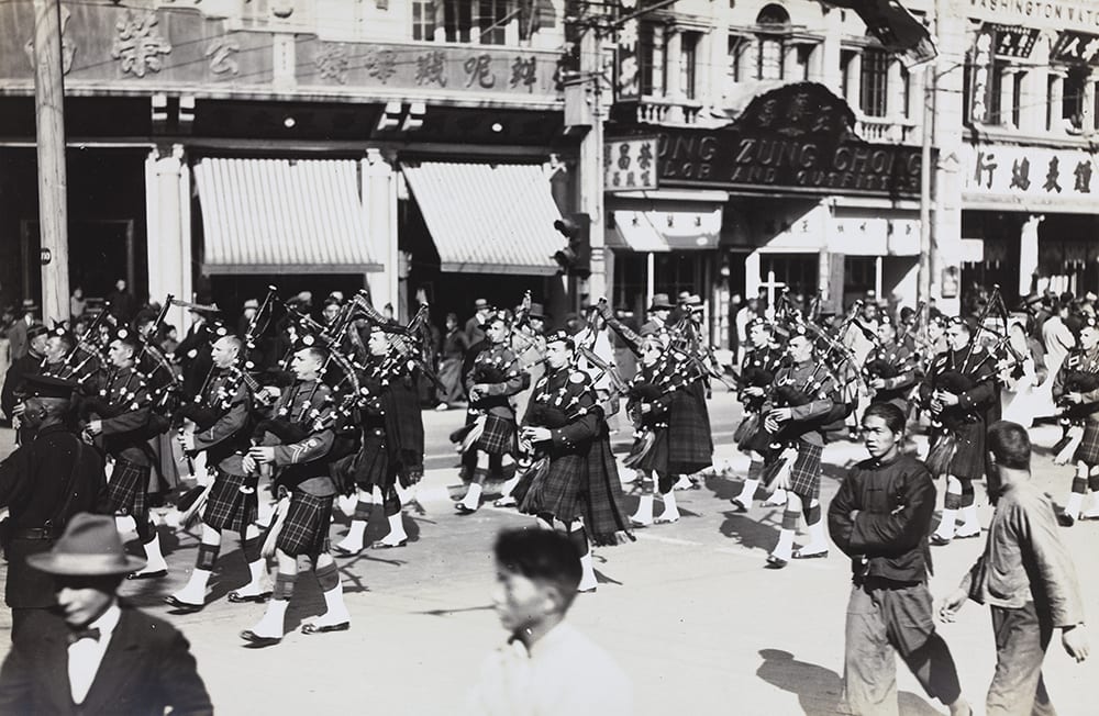 Scots Guards & Shanghai Scottish Pipers, HPC ref AL-s04. The Scots Guards arrived in Shanghai on 2 July 1928 and were based there until 20 January 1929 as part of the British Shanghai Defence Force which was established in January 1927 following an attack on the British concession in Hankow (Hankou) and the surrender of the concession.[2] Note the Chinese on-lookers for whom this was not only a routine ceremonial but, in the highly-charged circumstances of the time, a powerful demonstration of British military capacity.