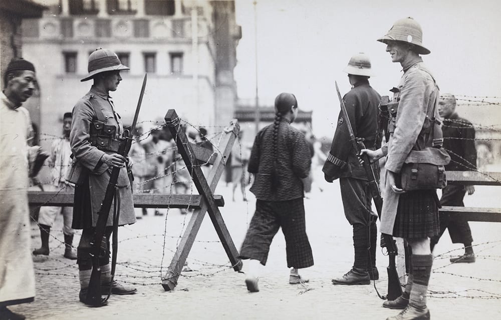 Shanghai Volunteer Corps at a street barricade. HPC ref AL-s12. Comprising a multi-national militia (including Chinese volunteers) under the control of British soldiers, the SVC, which was mobilised, for this emergency, in September 1924, represents the ambiguities of British military service on China’s sovereign territory.