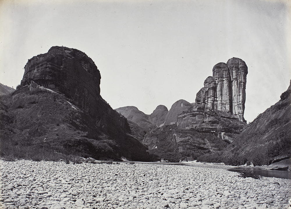 Jade Girl's Mirror-stand Peak on the Nine-bend river, Wuyi Mountains, near Xingcun, Fujian, c1869. Captioned in another album: ‘94. Gemmy Damsel's Mirror-stand Peak near Sing Chang Tea mart'. Photograph by Lai Fong (Afong Studio). HPC ref: Fr01-079.