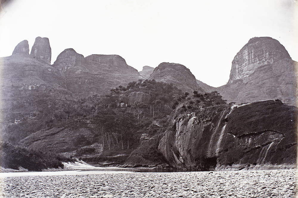 Drum Peak and other Wuyishan peaks, near Xingcun, Fujian, c1869. This is a fine photograph of groves of ancient tea trees in their natural mountain setting, one of several accomplished landscape photographs of dramatic Fujian scenery by Lai Fong. HPC ref: Fr01-090.
