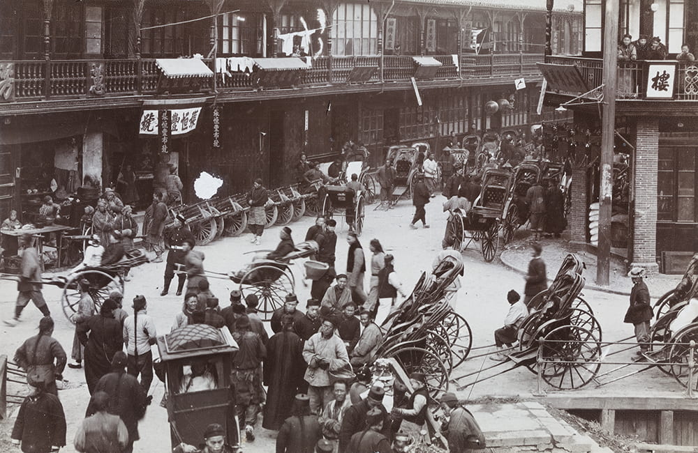 Shops, rickshaws and wheelbarrows outside the New North Gate, Shanghai, c.1890-1900. HPC ref: Wr-s019.