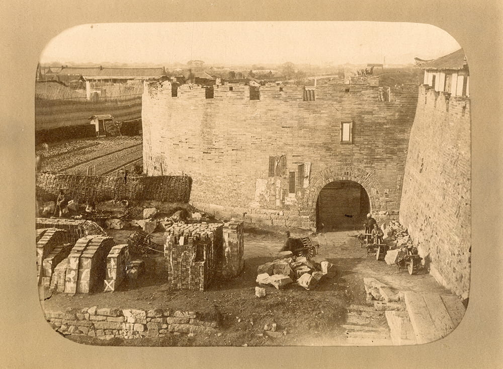 View from the city wall towards the West Gate, Shanghai. Photograph attributed to William Saunders or John Reddie Black. Published by John Reddie Black in ‘Far East’, January 1877.