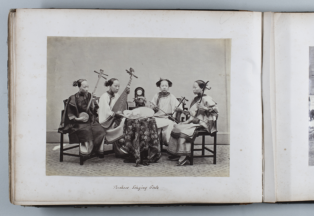Four musicians (singers), with instruments, Fuzhou, c.1868-1874 (HPC ref: Fr01-044). Photograph by Lai Fong (Afong Studio). A page from the John Gurney Fry album (DM2887).