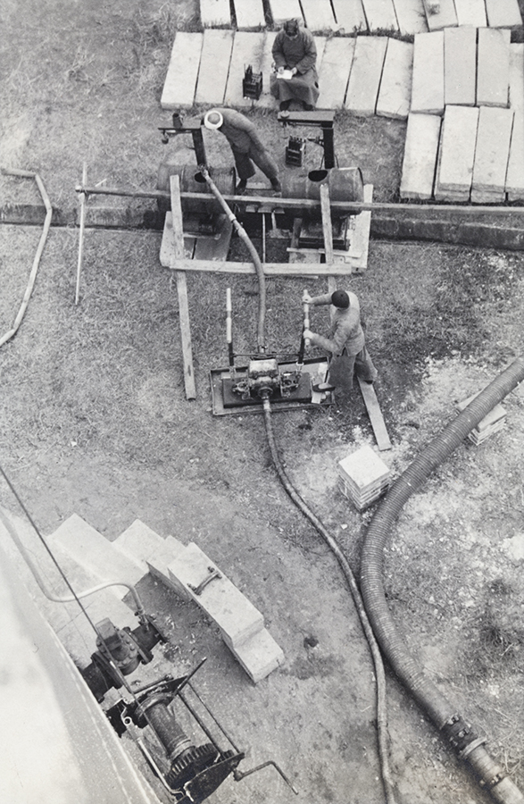 A Cartier-Bressonesque photograph by Cyril Whitaker, captioned in the album: ‘Calibrating a [petroleum] tank by pumping out and weighing water on alternate scales. Jan. 1938’ (HPC ref: CW08-80). Whitaker was a talented ‘semi-pro’ photographer who documented the Asiatic Petroleum Company (APC) installation near Chongqing. Cyril Whitaker Collection, DM2845/8.